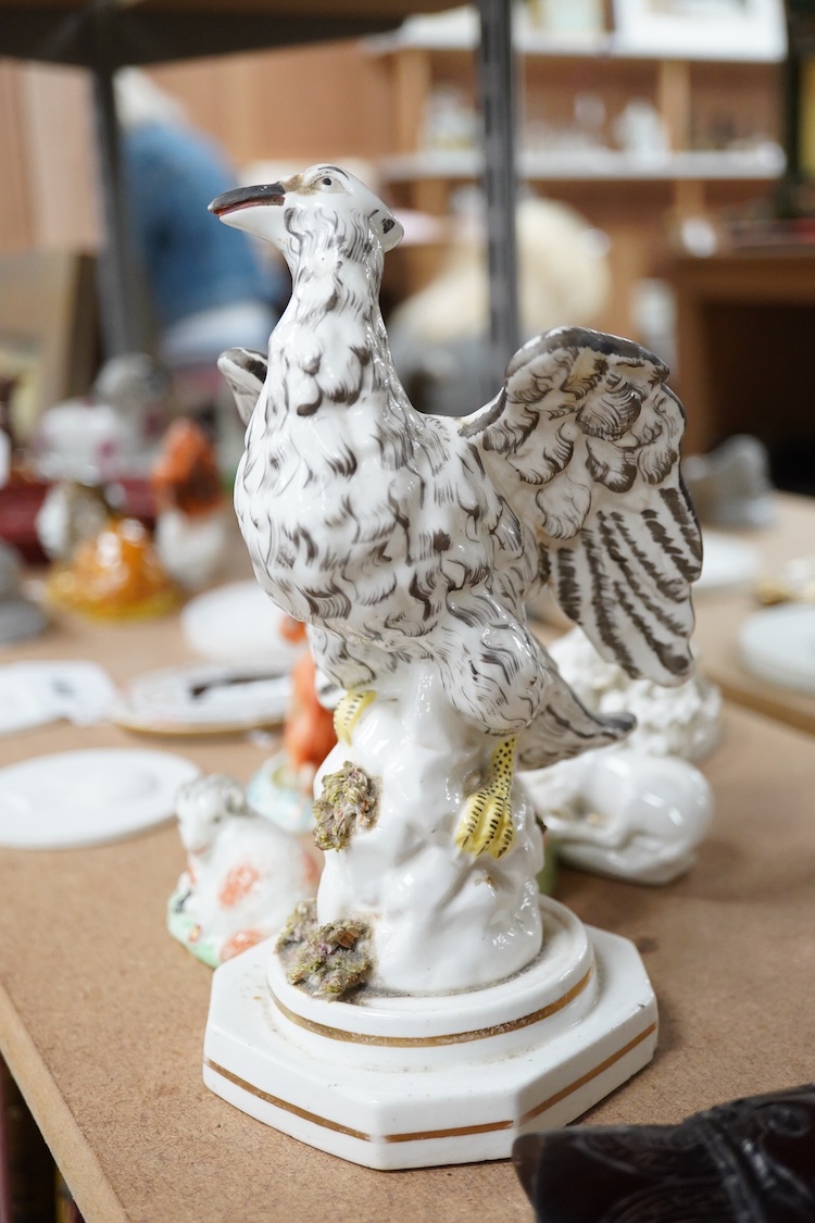 A rare Staffordshire porcelain model of an eagle or vulture, c.1830-50, and five Derby porcelain models, 1810–30; two recumbent sheep, a pug dog, a deer and a dove, 20cm high